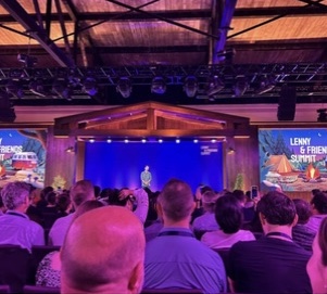 A full audience in the warmly lit Summit hall
